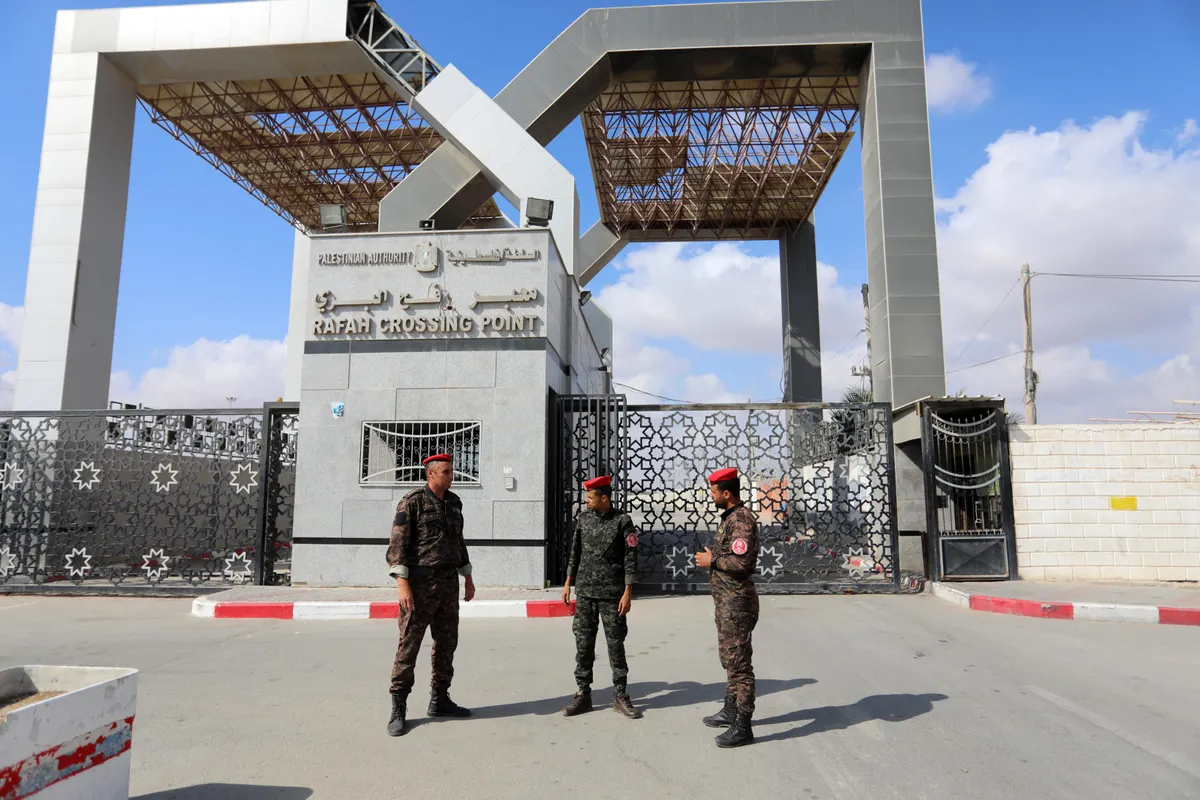 members-of-palestinan-security-forces-stand-guard-at-the-closed-off-rafah-border-crossing-to-egypt-in-the-southern-gaza-strip